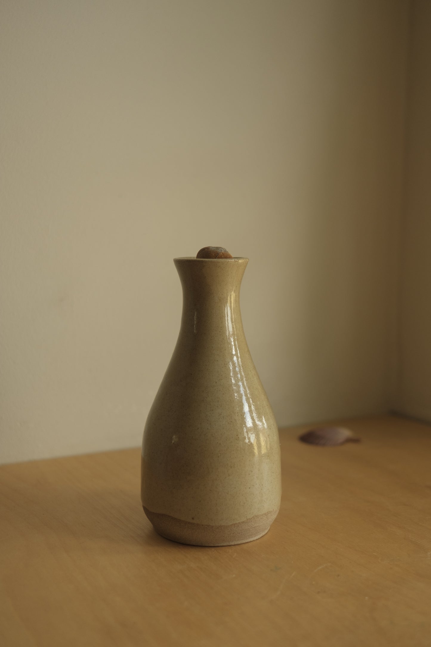 ceramic bottle with foraged stone cork
