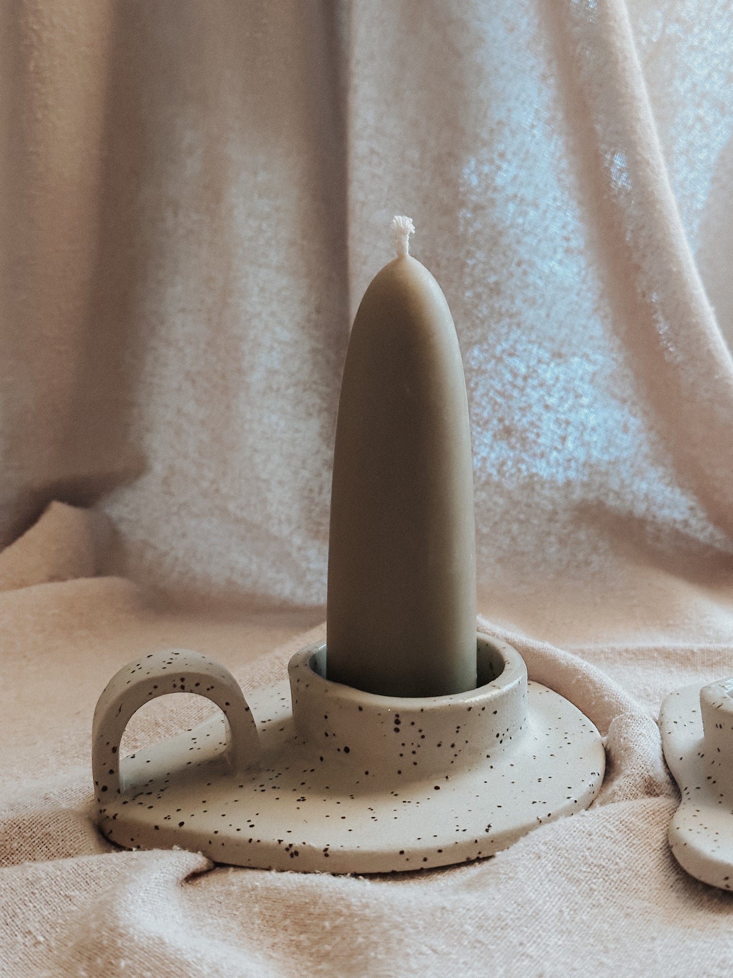 freckled ceramic candle holder with arc