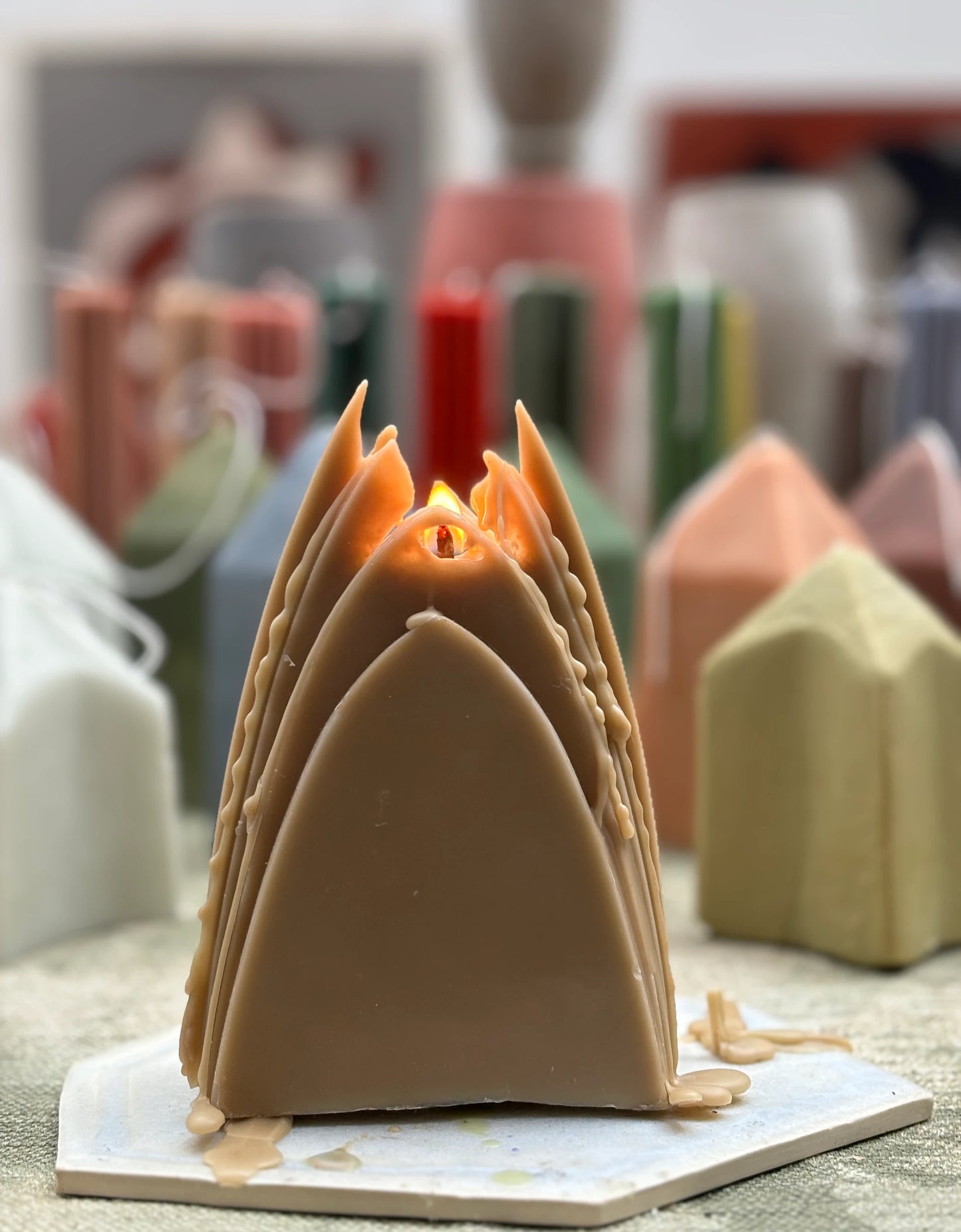 arch candle: earth tones