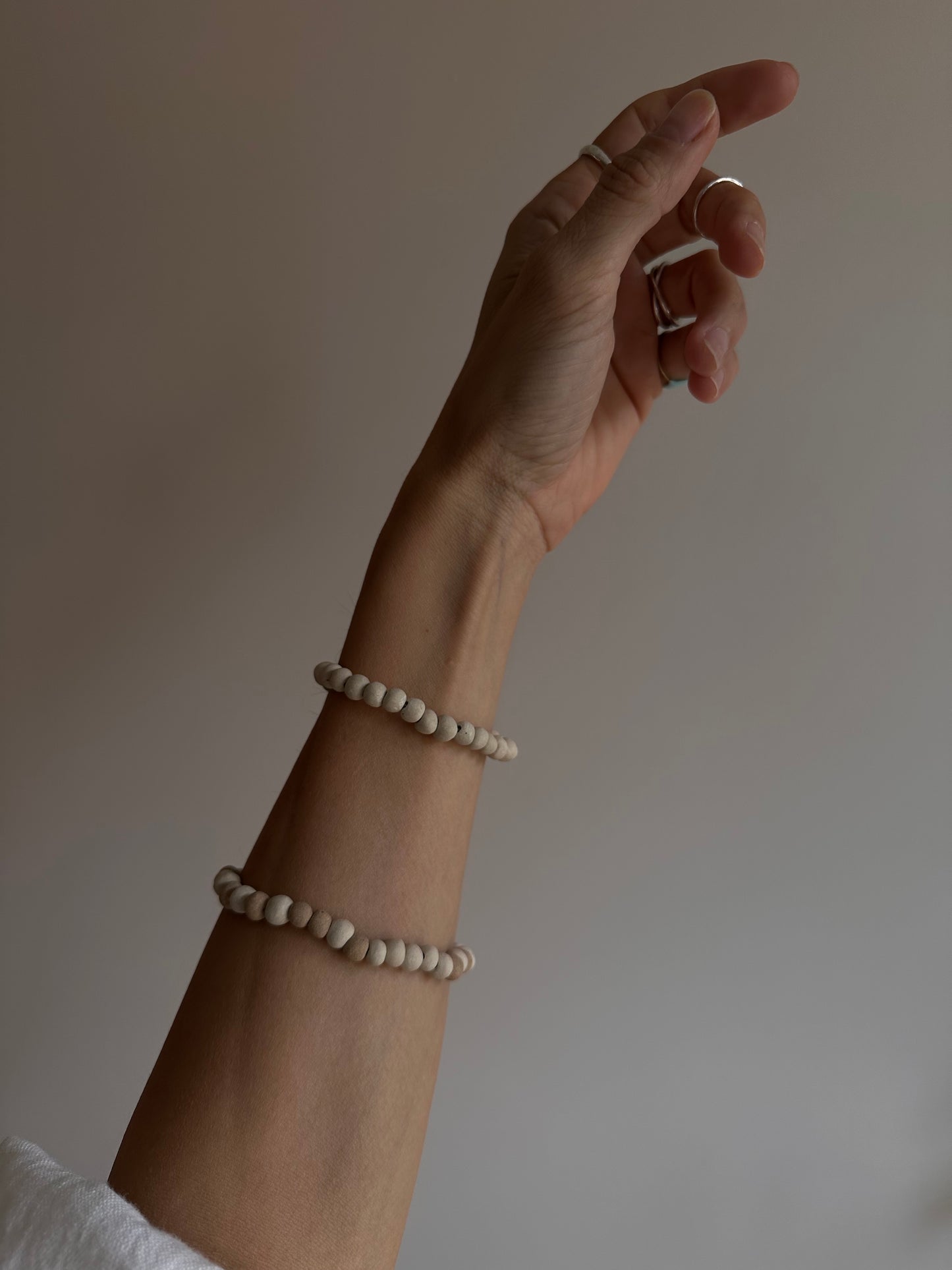 organica clay bead bracelet in sediment