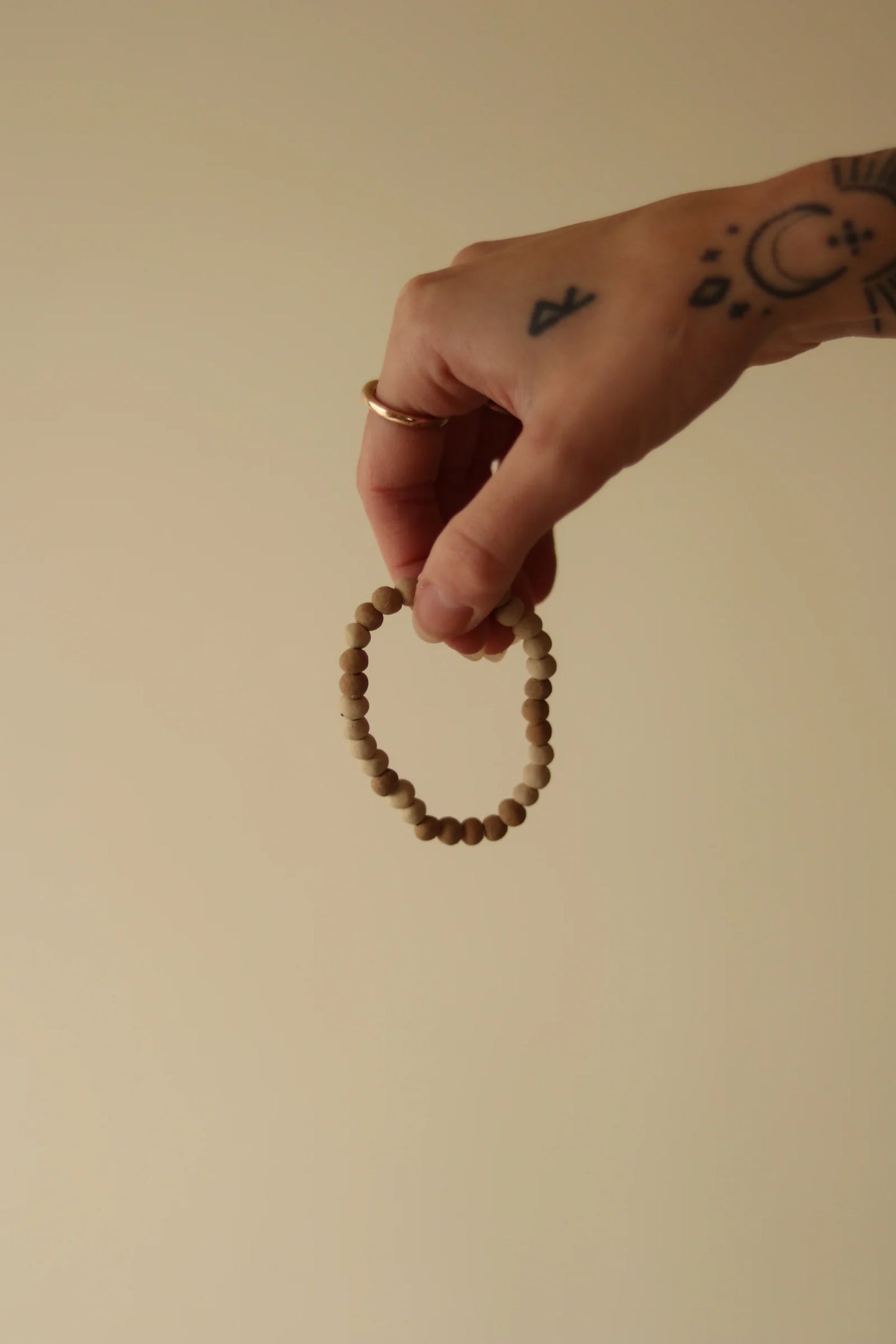 organica clay bead bracelet in sediment