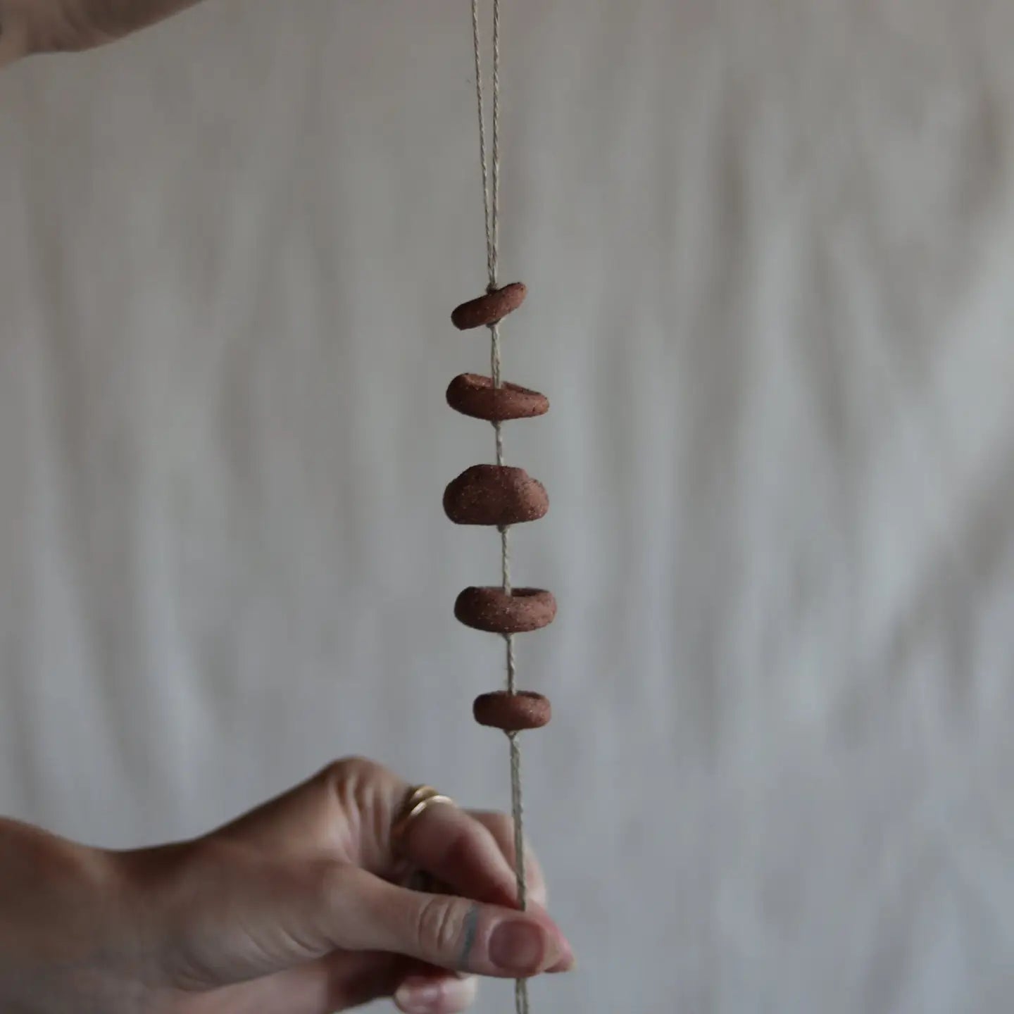 gathered red earth talisman wall hanging