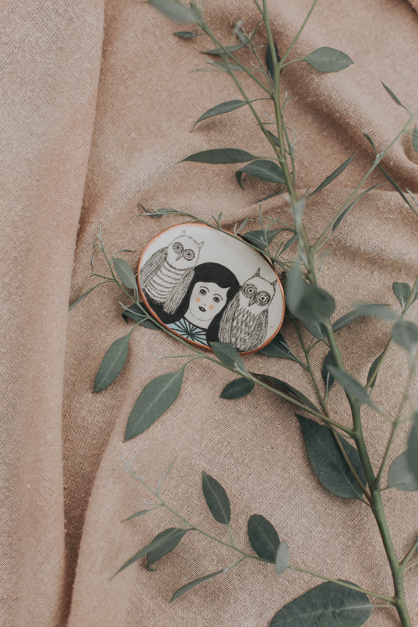 girl with art in hair brooch