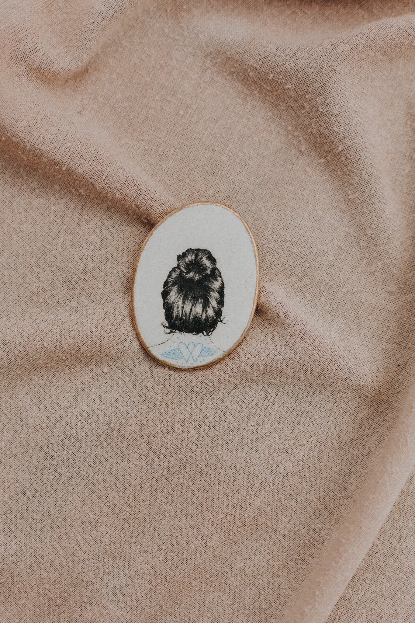 girl with art in hair brooch