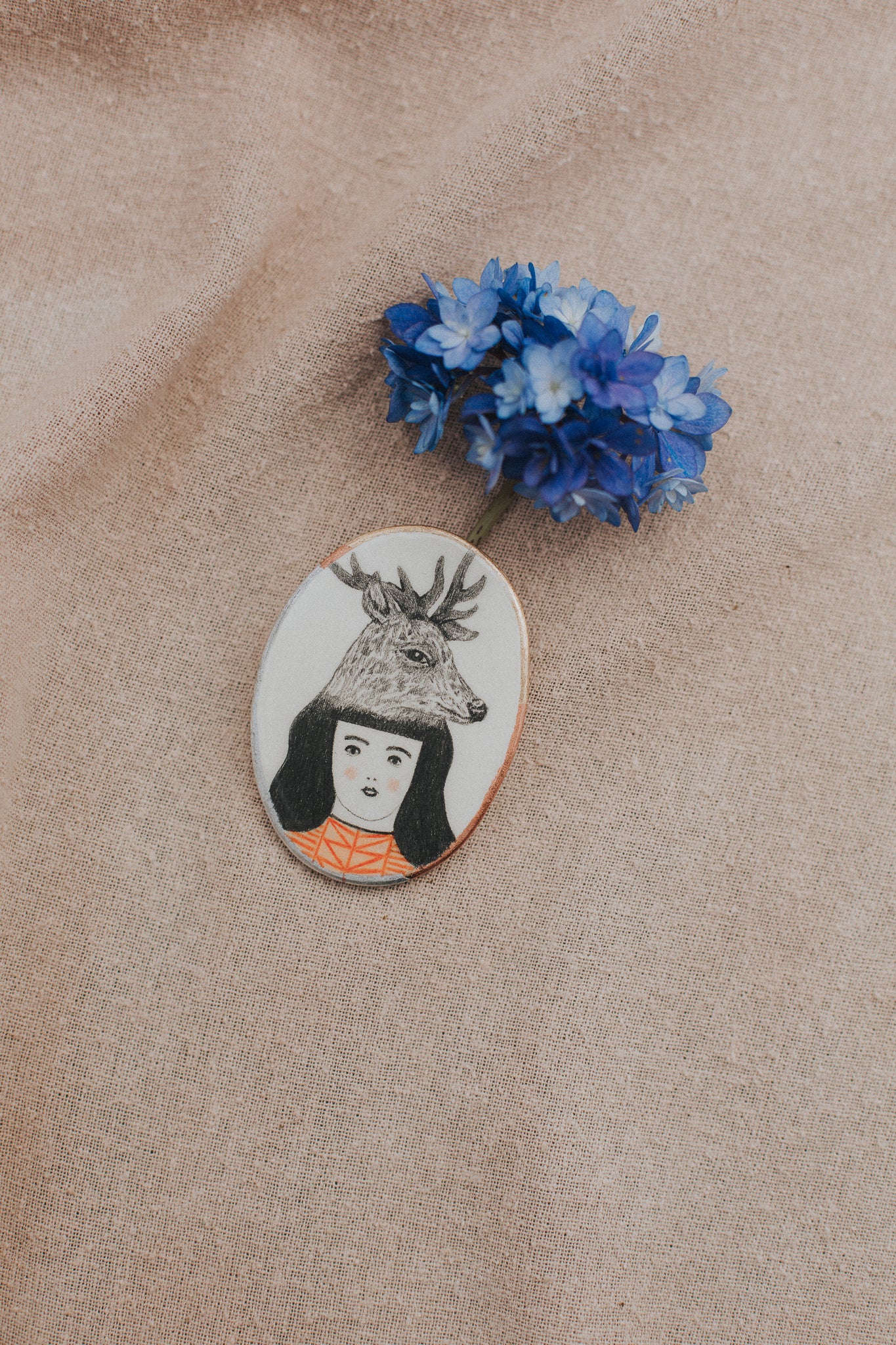 girl with art in hair brooch