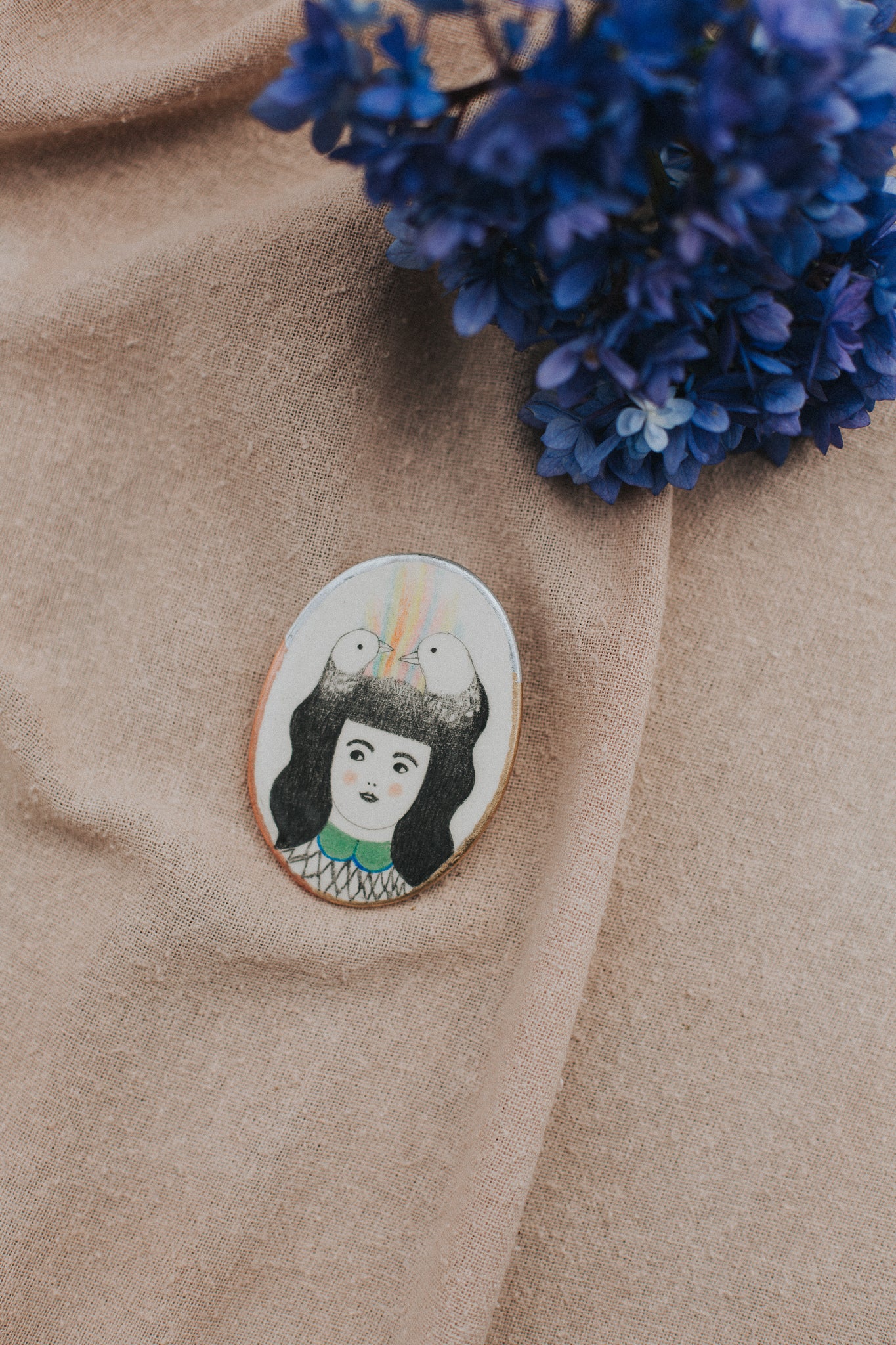 girl with art in hair brooch