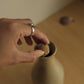 ceramic bottle with foraged stone cork