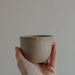 200 ml cup in warm sand by linda bredenbekk