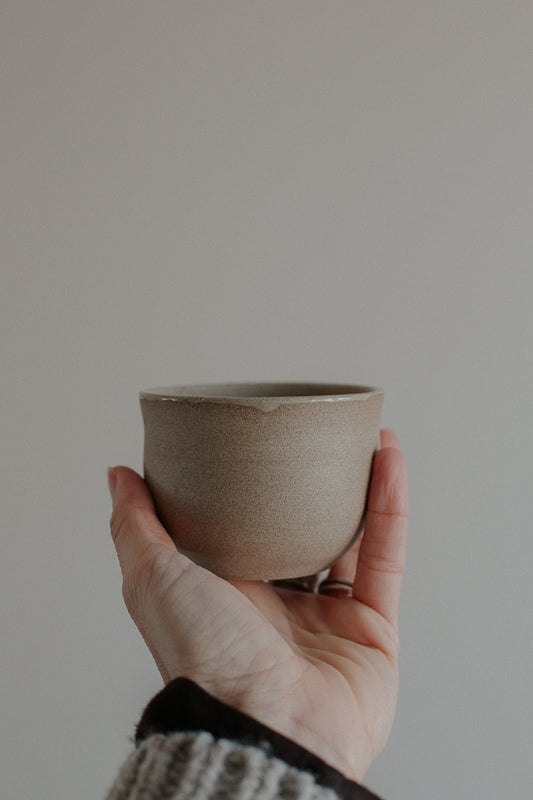 200 ml cup in warm sand by linda bredenbekk