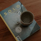 200 ml cup in warm sand by linda bredenbekk