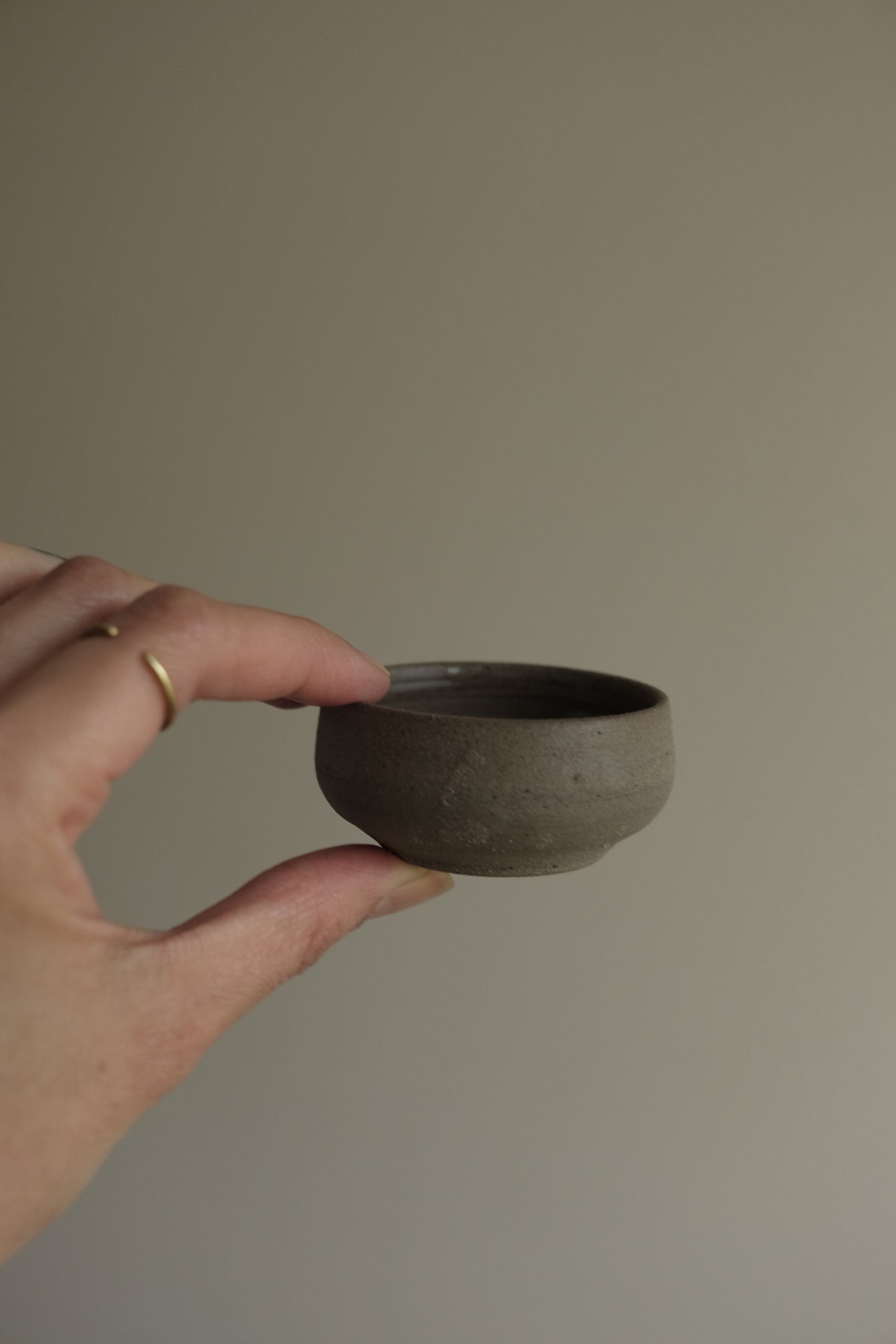 rounded edges trinket dish in warm gray by linda bredenbekk