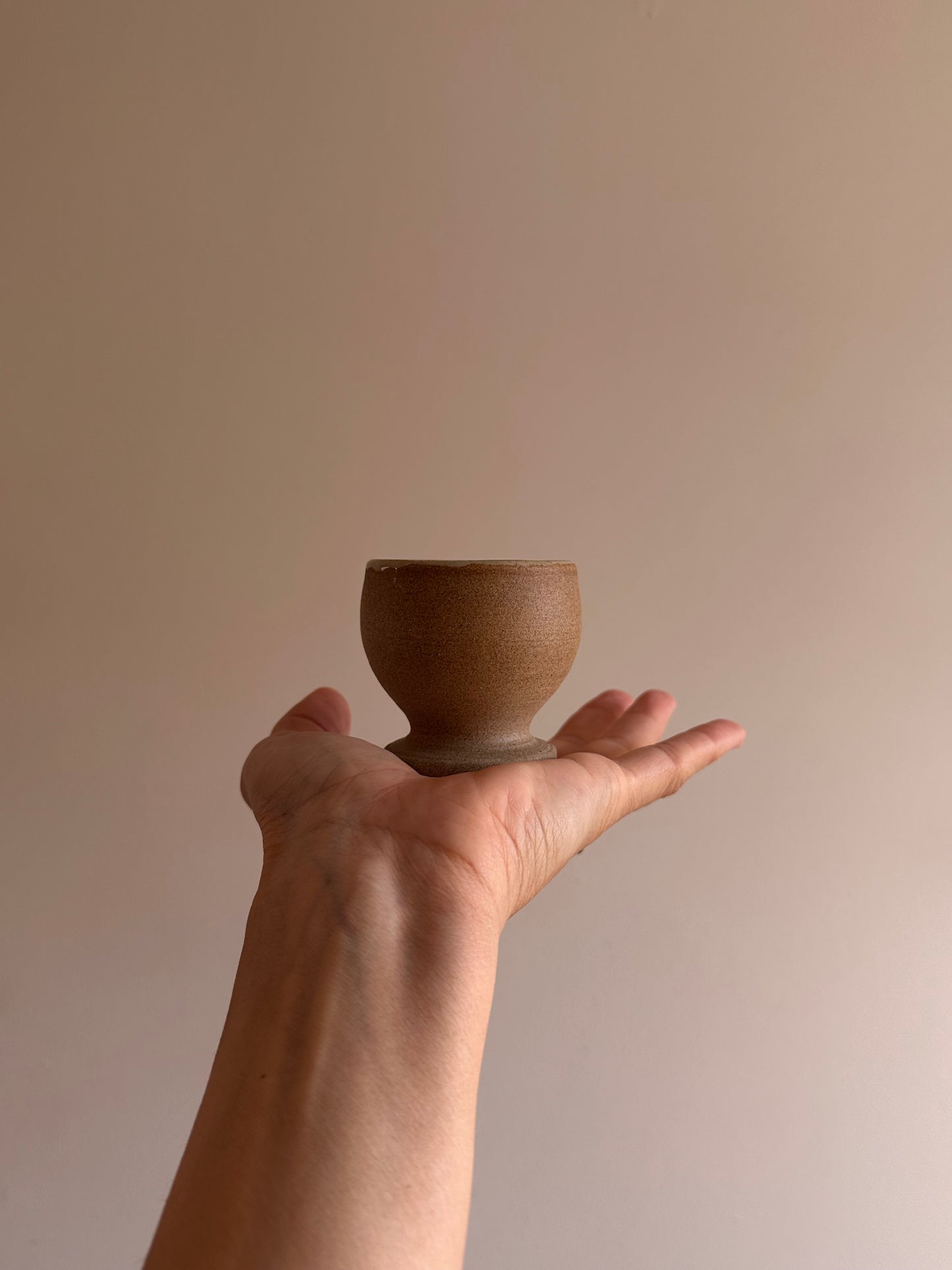 egg holder footed cup in warm earth by linda bredenbekk
