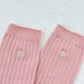 her embroidered socks