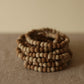 organica clay bead bracelet in sediment