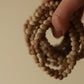 organica clay bead bracelet in sediment