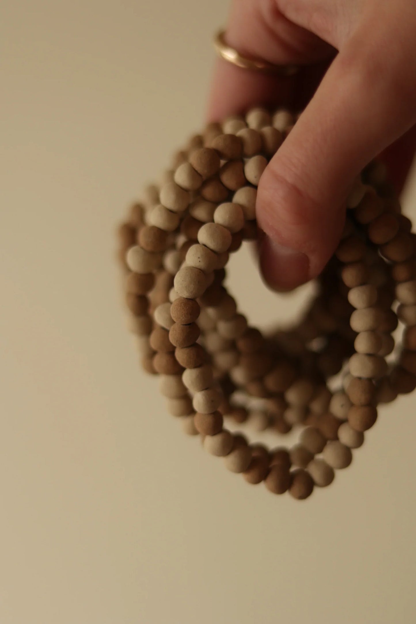 organica clay bead bracelet in sediment