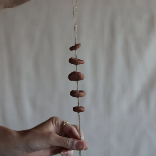 gathered red earth talisman wall hanging