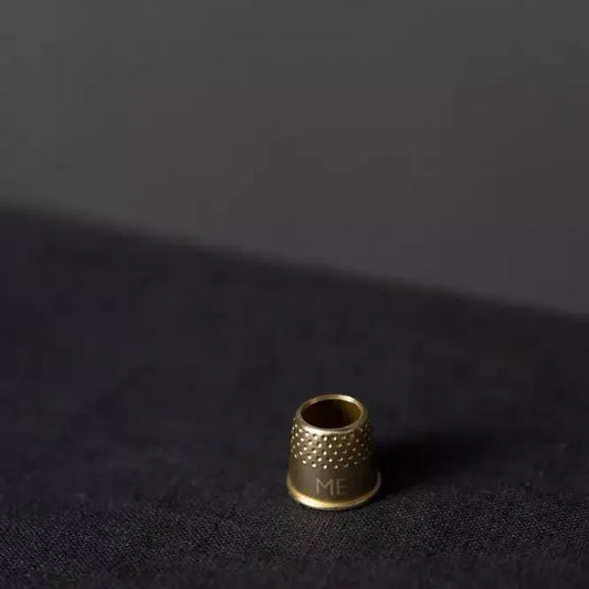 brass tailor's thimble
