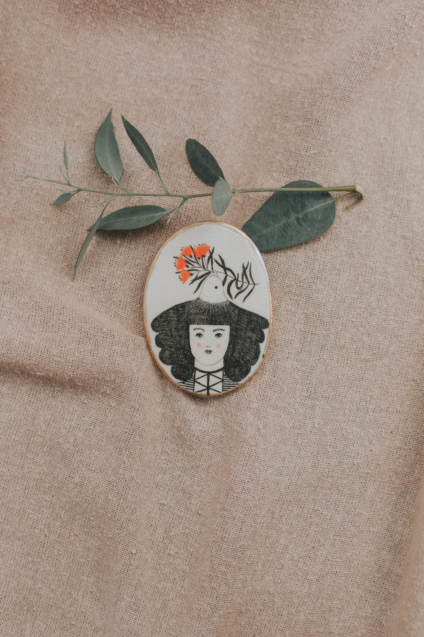 girl with art in hair brooch