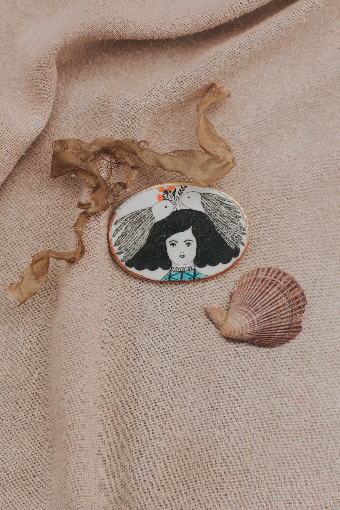 girl with art in hair brooch